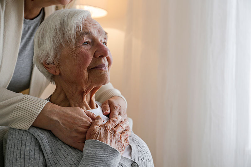 woman-comforting-senior-lady-with-anxiety